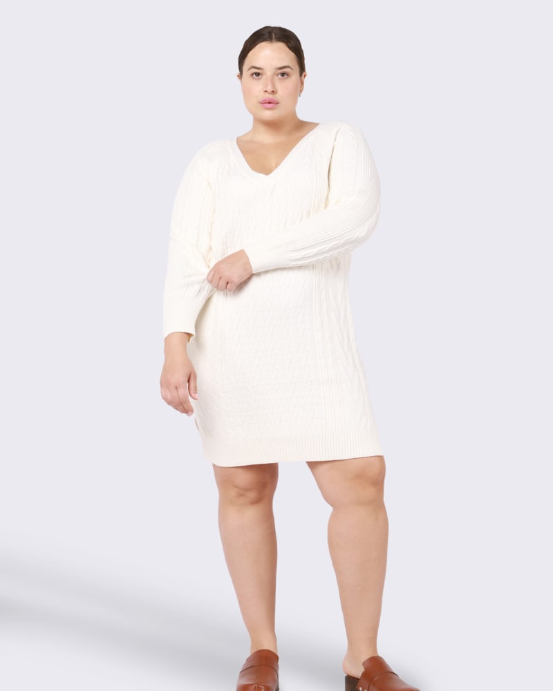 Front of a model wearing a size 0X Blair V-Neck Cable Knit Sweater Dress in Ivory by DEX PLUS. | dia_product_style_image_id:246209